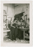 Eva Weinberger works in the carpentry workshop [in what may be a kibbutz hachshara in Switzerland].