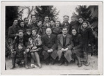 Group portrait of Jewish survivors from Zhetel who had fought with the Lenin Brigade, taken shortly after liberation.