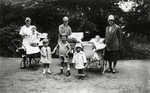 Young German-Jewish children pose with their nannies in Hain Park.