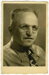 Studio portrait of Lajos Ornstein taken on the third anniversary of his arrival in Israel.