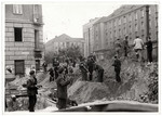 Poles dig trenches in Warsaw to protect the capital against German invasion.