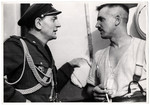 A Polish captain questions a German prisoner from East Prussia.