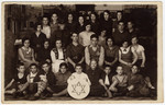 Group portrait of Jewish children and teenagers belonging to a Betar Zionist group in Latvia.