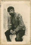 Close-up portrait of a Jewish man with a cigarette.