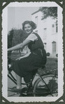 Miriam Wheeler, a cousin of Anita Lamm, rides a bicycle..
