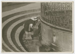 An Arab man washes at a fountain [possibly outside the Dome of the Rock].