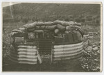 View of a crude fort made of metal sheet and sandbags protecting a settlement in the Valley of Jezreal.