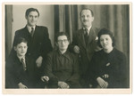 Studio portrait of an extended family of Jewish refugees in Switzerland.