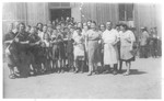 Group portrait of men, women and children of the Prokocim labor camp in Krakow.