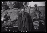 Gina Rappaport (later Leitersdorf) stands next to an American tank shortly after her liberation.
