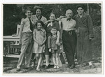 Norbert, Helmut, and Erna Isenberg pose with extended family members.