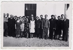 A group of Jewish men and women pose at the Rivesaltes internment camp.