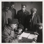 Maurice Levitt and other members of the Frankfurt Jewish GI Council meet with young religious boys learning Hebrew in Dieburg.