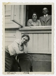 Portrait of Rabinowitz family members at an open window.