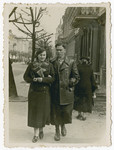 A Jewish couple walks down the street.

The inscription on the back of the photo reads, "4/20/1936.