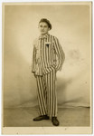 Postwar studio portrait of Mayer Honigsberg.wearing a concentration camp uniform.