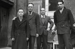 Shalom Kaplan poses with his father and other staff from the Unzer Weg newspaper.