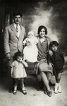 Prewar studio portrait of the Tayar family.

Pictured left to right are Daniel Tayar, Rene, Roger (baby), Simcha and Raoul.