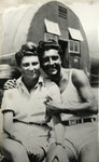 Hilda Kreiser and Raoul Tayar pose in front of a Quonset hut prior to their wedding in the Cyprus internment camp.