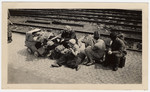 German women wait for repatriation.

Original caption:  "German refugees wait for transportation."