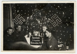 German soldiers on the eastern front relax at a Christmas celebration somewhere in the USSR.