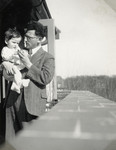 Joseph Mossel holds his year-and-a-half old daughter, Henriette.