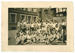 A group portrait of girls in a gymnasium schoool.