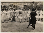 A Jewish born woman conducts a school orchestra in a Catholic school near Budapest.