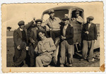 Jewish forced laborers pose next to a truck in Bulgaria.