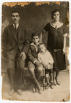 Prewar studio portrait of a Greek Jewish family.

Pictured are the Yaffes: Samuel, Joyia and their children, Mordo and Alberto.