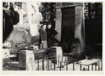 Two women visit the grave of Theodor Herzl in the cemetery of Doebling.