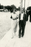 Ethel Rytt and Feivel Frankfowicz walk down a street in Kowel.