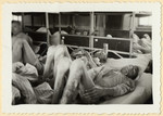 Starving prisoners lie on their bunks in the Dachau concentration camp shortly after liberation.