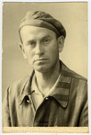 Studio portrait of Oskar Russ (step-father of the donor) wearing his concentration camp uniform shortly after liberation, .