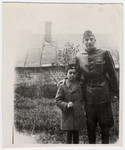 Janos Kovacs poses with his stepfather Bela Reiner who is wearing his Hungarian army uniform.