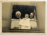 Pinchas Weissberg looks out a train window with his daughter, Natalia Schwarzwald, and her baby daughter, Elzbieta.