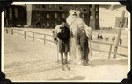 Egon and Edith Weiss pose with a someone in a bear costume while while on winter vacation in the mountains of Bavaria.