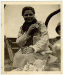 Close-up portrait of a newly liberated, female, Russian slave laborer eating American rations.