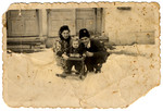 Yevgeniy and his first wife Rozsi play with their young son in the snow.