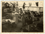 Immigrants relax on the deck of the Caserta while en route to Palestine.