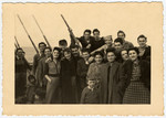 New immigrants gather on the deck of [what probably is] the Galila while en route to Israel from Romania.