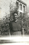 Eva (Hava) Weiss stands outside [probably in front of her house] in 1941, about three years prior to her deportation to Auschwitz.
