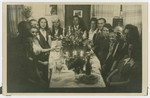 Jewish displaced persons sit down to a festive meal, possibly in Weiden.