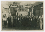 Group portrait of young Zionists in the Zeittlitz training farm posing underneath posters of Weizmann, Gordon and Herzl.