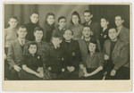 Group portrait of Jews in the Bedzin ghetto wearing the Jewish star.