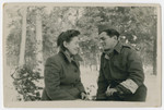 Close up portrait of a Jewish policeman and his girlfriend in the Foehrenwald displaced persons camp.