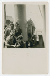 A group of Jewish displaced persons pose on the deck of a ship [probably en route to Palestine].