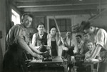 Jewish internees work in the wood workshop in the Novaky concentration camp.