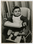 Sara Radzelli sits in her high chair in the Schlachtensee displaced persons' camp.