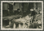 Three teenage boys work in a carpentry workshop in a Zionist children's home in Switzerland.